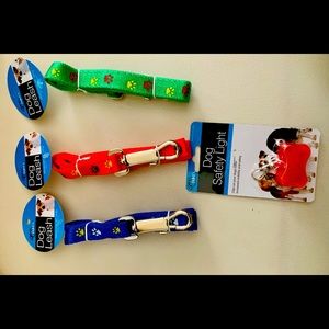 Paw-print dog leash with dog safety light.